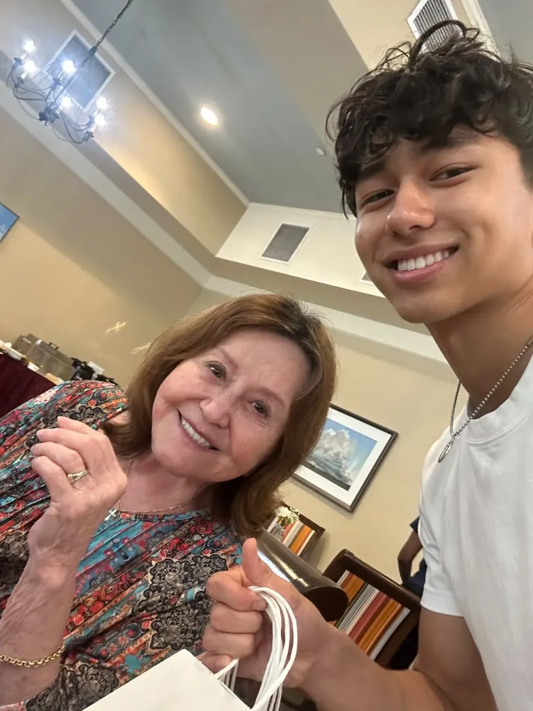Marcella with a Hearts for Elders volunteer during a visit